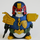 Illustration for article titled A Penguin Cosplaying As Judge Dredd Is An Actual Toy You Can Buy